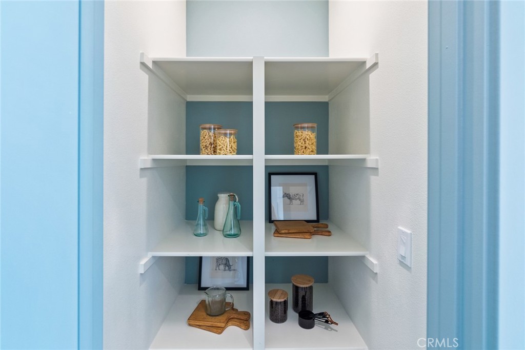 12352 Van Gogh Place Yucaipa, CA 92399 - Photo 24 of 44 a shelf with books and knick knacks on it