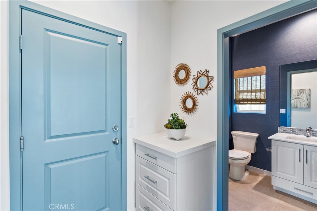 12352 Van Gogh Place Yucaipa, CA 92399 - Photo 26 of 44 a living room with a toilet and a potted plant