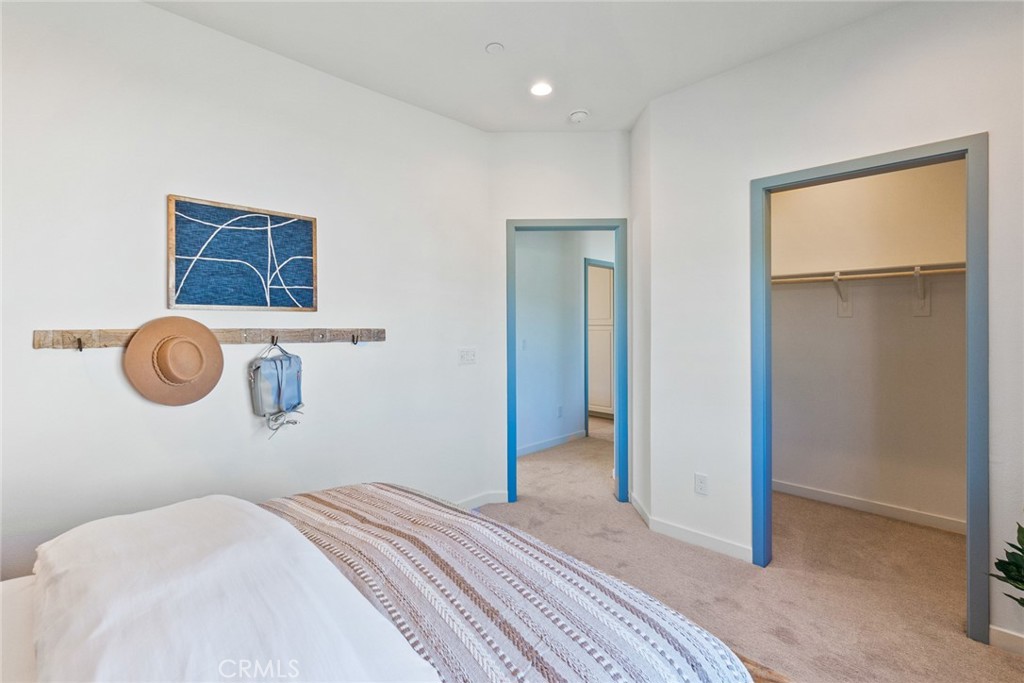 12352 Van Gogh Place Yucaipa, CA 92399 - Photo 36 of 44 a bedroom with a bed and a window