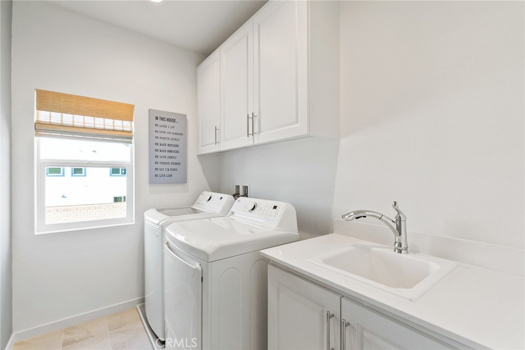 12352 Van Gogh Place Yucaipa, CA 92399 - Photo 38 of 44 a utility room with dryer and washer