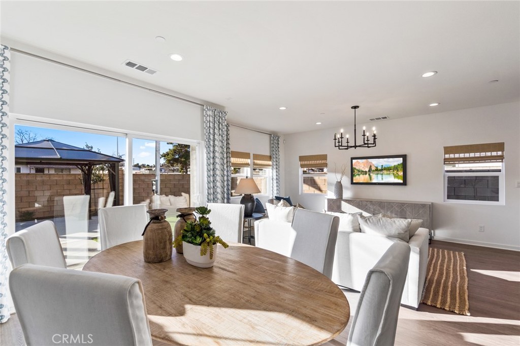 12352 Van Gogh Place Yucaipa, CA 92399 - Photo 4 of 44 a living room with furniture and wooden floor