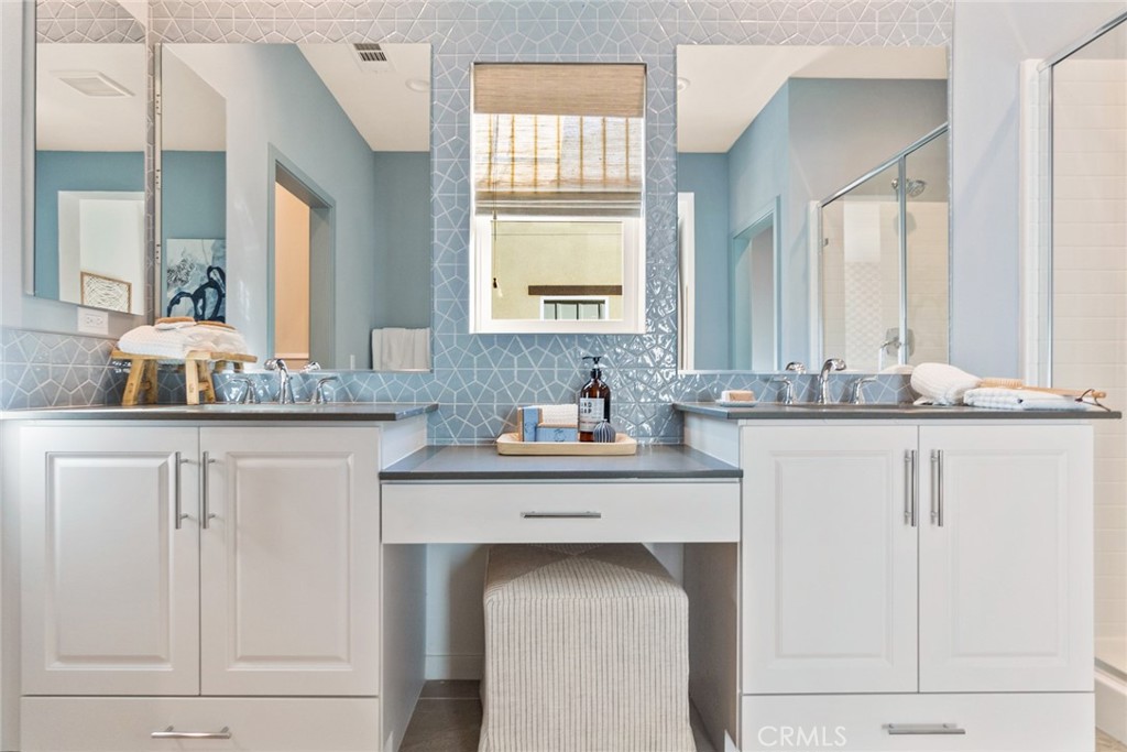 12352 Van Gogh Place Yucaipa, CA 92399 - Photo 42 of 44 a bathroom with a sink and a mirror