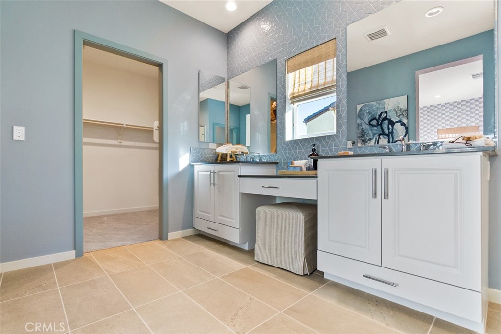 12352 Van Gogh Place Yucaipa, CA 92399 - Photo 43 of 44 a kitchen with white cabinets appliances and sink