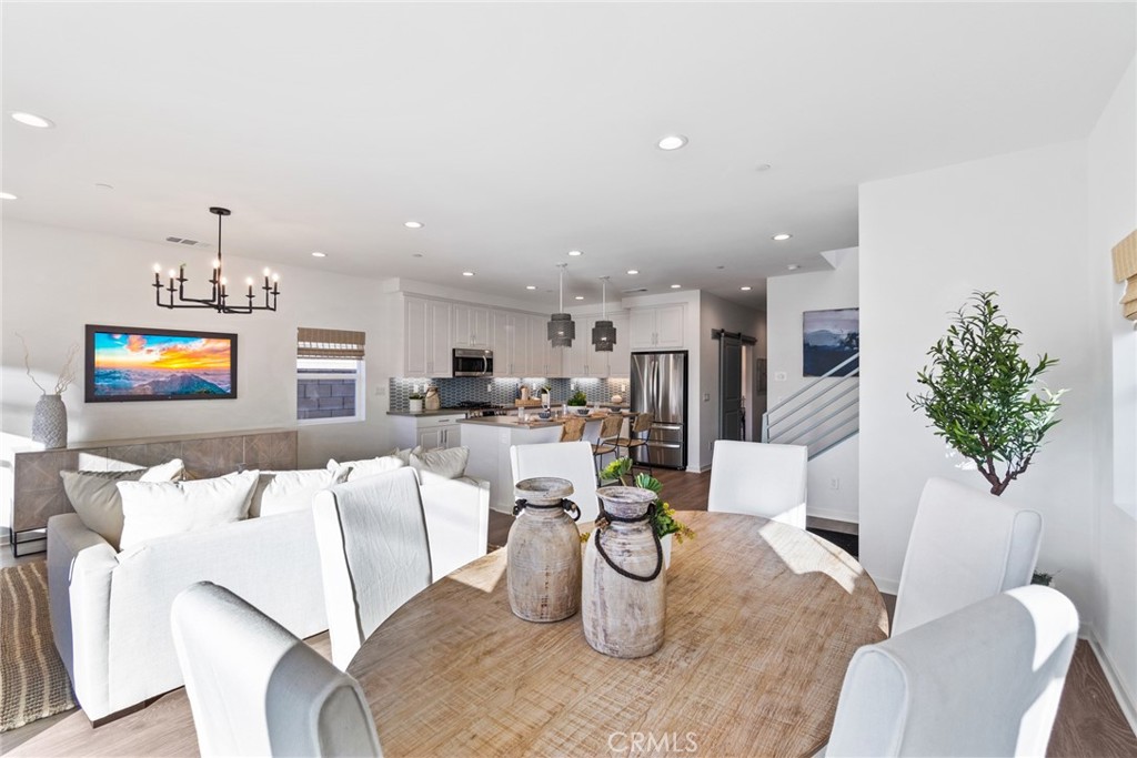 12352 Van Gogh Place Yucaipa, CA 92399 - Photo 5 of 44 a living room with furniture a window and kitchen view