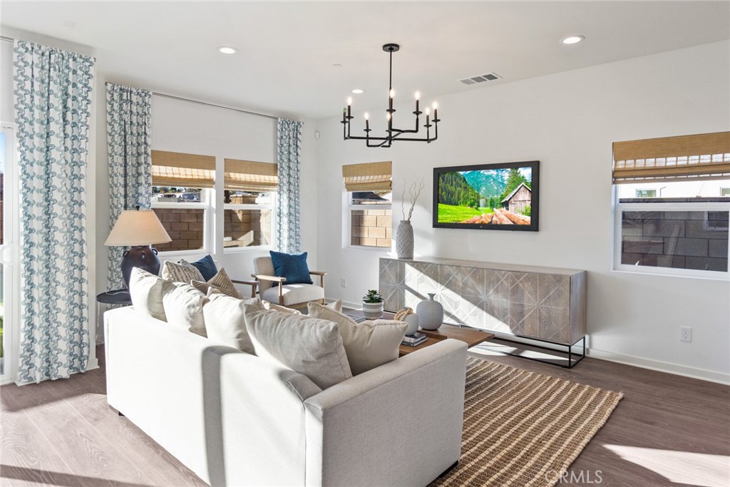 12352 Van Gogh Place Yucaipa, CA 92399 - Photo 7 of 44 a living room with furniture and a flat screen tv