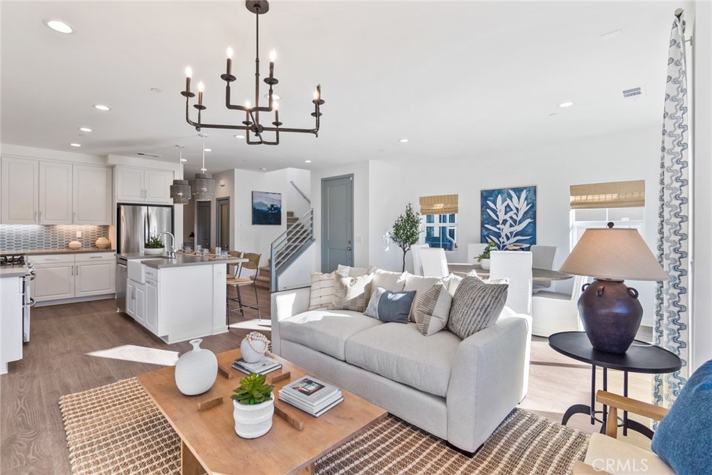 12352 Van Gogh Place Yucaipa, CA 92399 - Photo 9 of 44 a living room with furniture and kitchen view