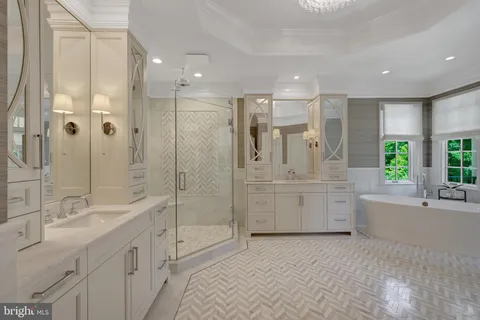 a bathroom with a granite countertop sink mirror and shower