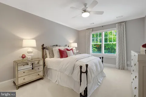 a bed room with a bed and a window