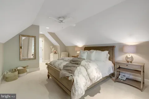 a bedroom with a bed and a lamp