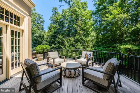 a view of a patio with a dining table and chairs
