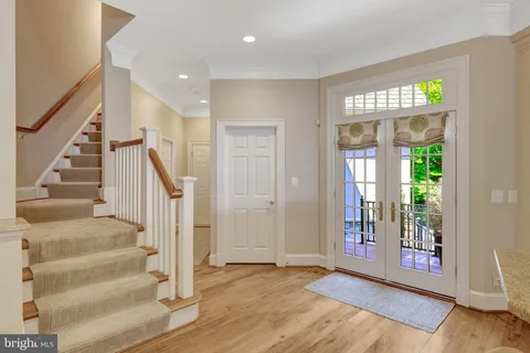 a view of an entryway with wooden floor