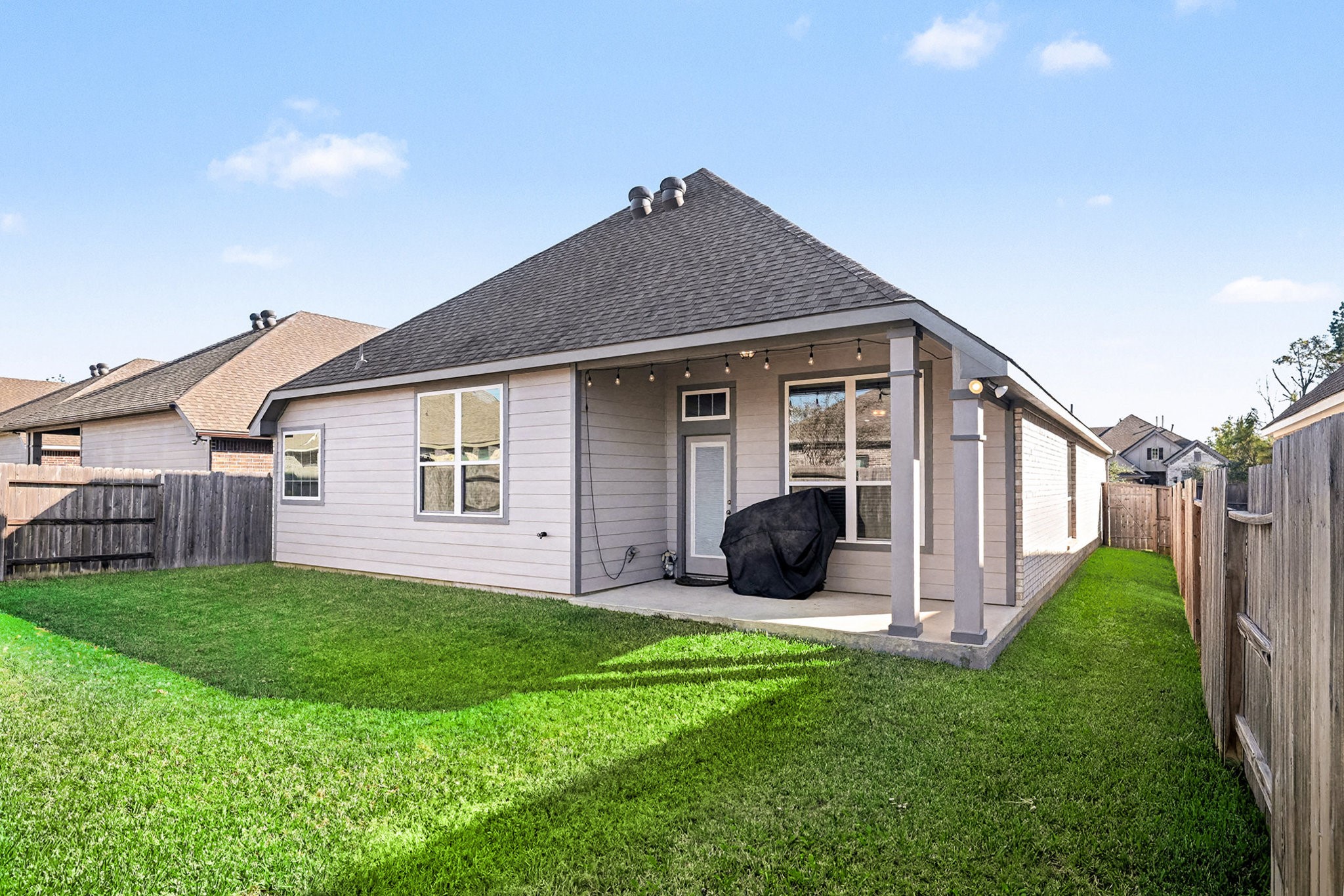 3309 Rolling View Court Conroe, TX 77301 - Photo 24 of 27 Relax or entertain in the backyard complete with a covered patio and green space.
