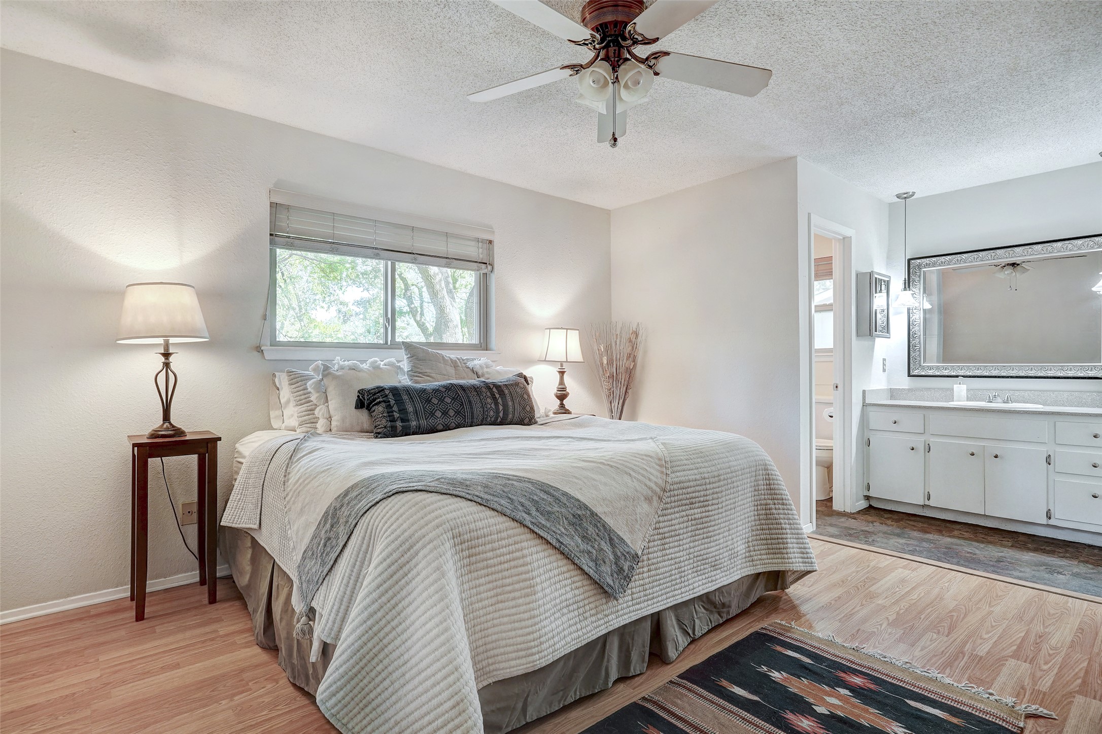 1105 North Riviera Circle Cedar Park, TX 78613 - Photo 17 of 32 a bedroom with a bed and a chandelier