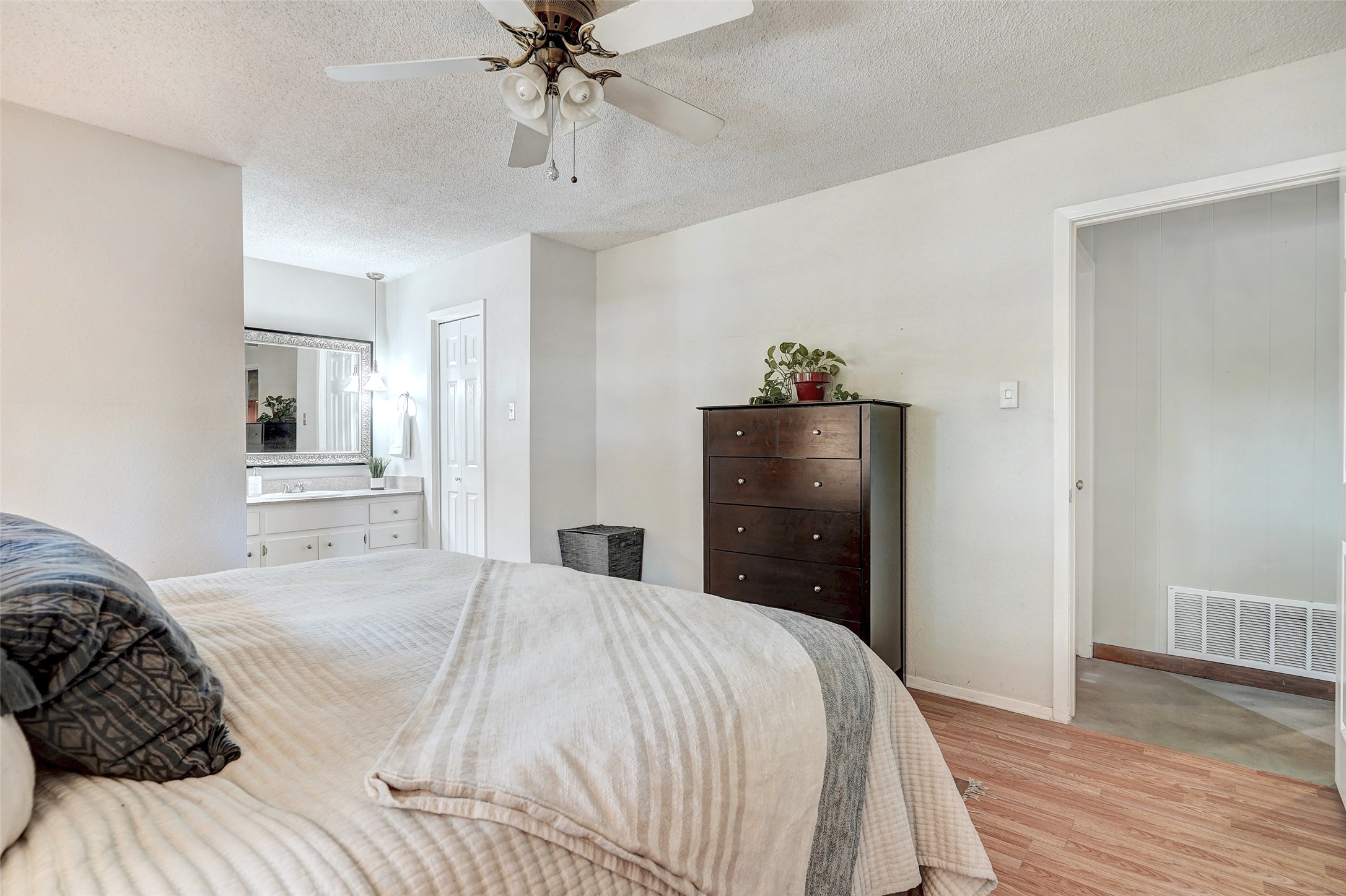 1105 North Riviera Circle Cedar Park, TX 78613 - Photo 18 of 32 a bedroom with a bed and wooden floor