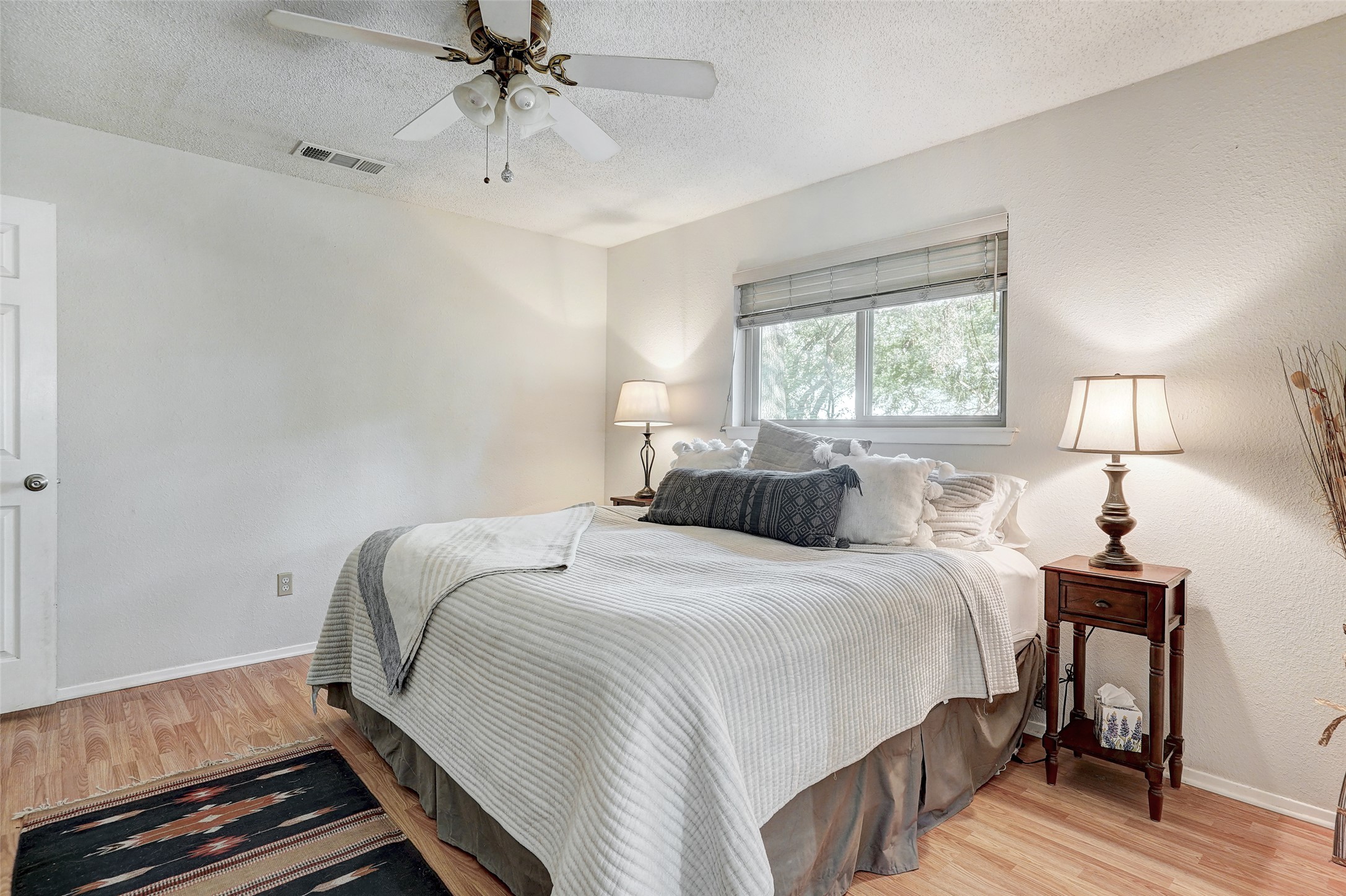 1105 North Riviera Circle Cedar Park, TX 78613 - Photo 19 of 32 a bedroom with a bed and a chandelier