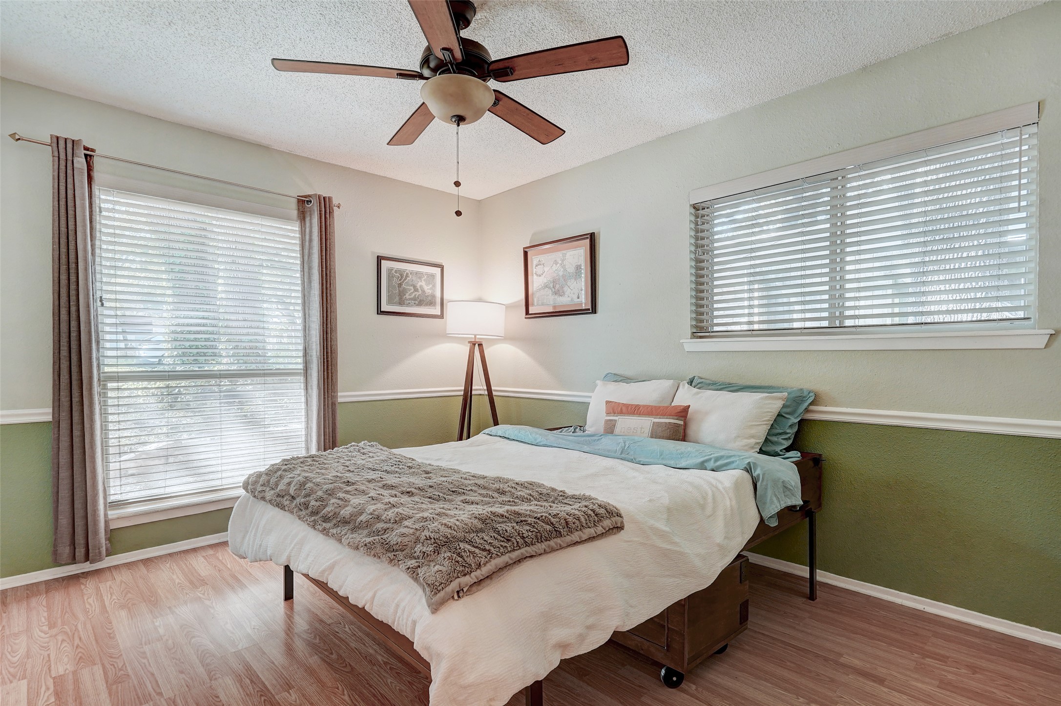 1105 North Riviera Circle Cedar Park, TX 78613 - Photo 22 of 32 a bedroom with a large bed and a large window