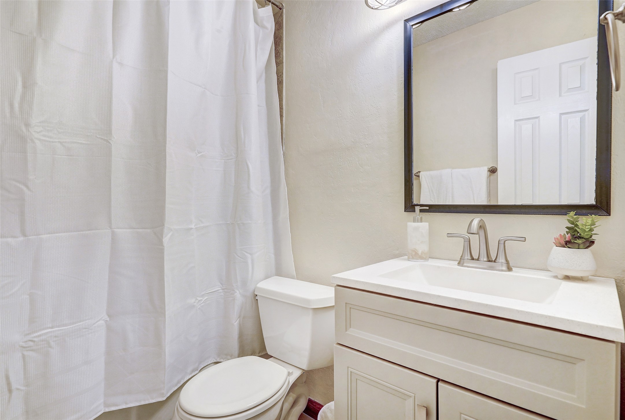 1105 North Riviera Circle Cedar Park, TX 78613 - Photo 23 of 32 a bathroom with a sink a toilet and a mirror