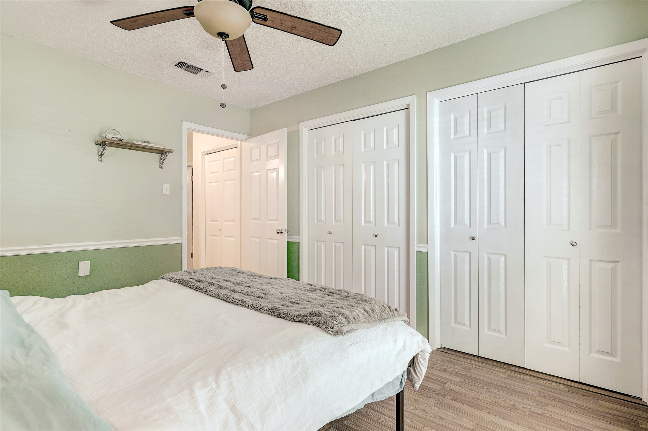 1105 North Riviera Circle Cedar Park, TX 78613 - Photo 24 of 32 a bedroom with a bed and a chandelier