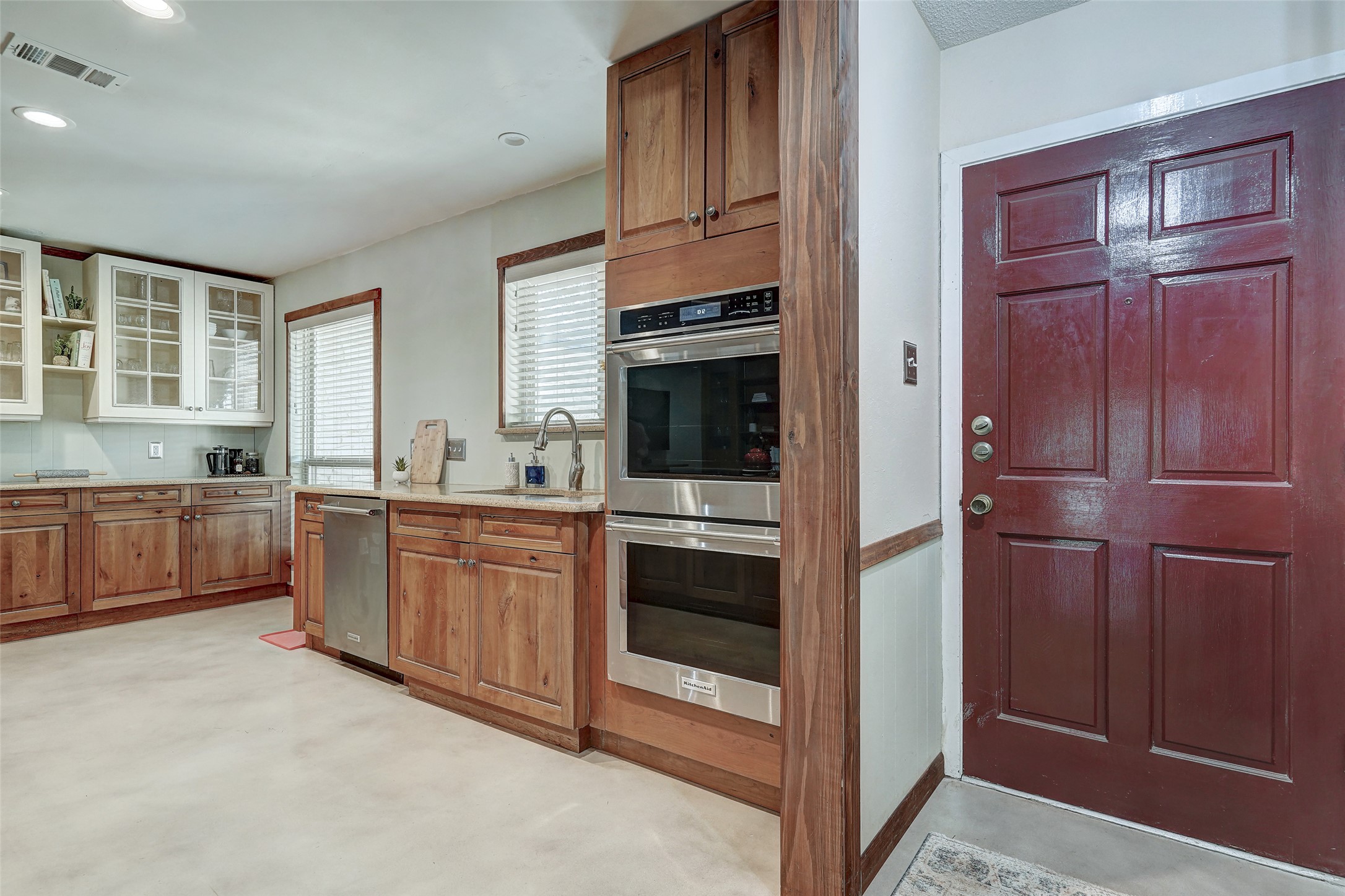 1105 North Riviera Circle Cedar Park, TX 78613 - Photo 5 of 32 a kitchen with granite countertop a refrigerator and cabinets