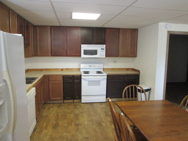 201 Dye Road Gray, GA 31032 - Photo 13 of 20 a kitchen with a stove a refrigerator and a sink