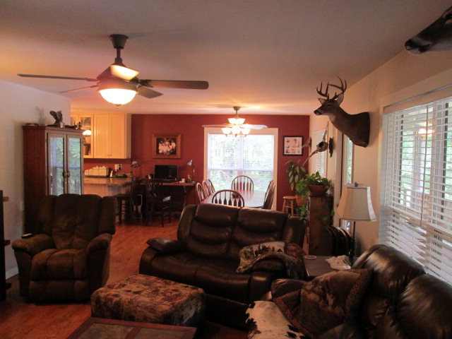 201 Dye Road Gray, GA 31032 - Photo 14 of 20 a living room with furniture a large window and a chandelier