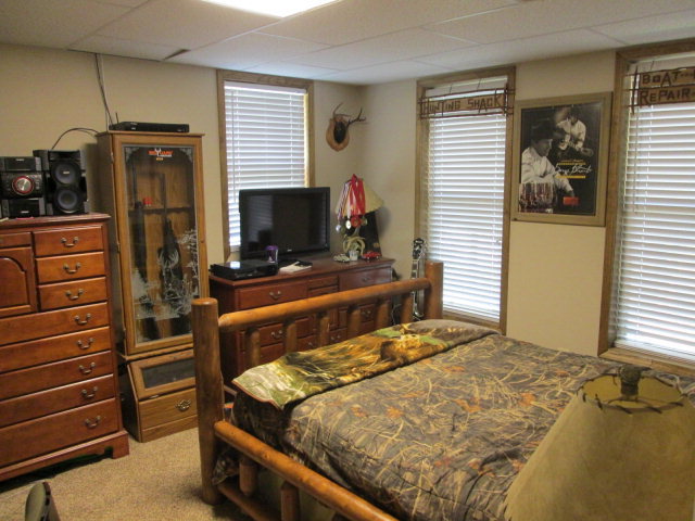 201 Dye Road Gray, GA 31032 - Photo 17 of 20 a bedroom with a bed and a flat screen tv
