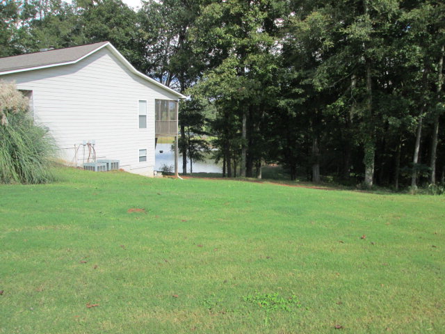 201 Dye Road Gray, GA 31032 - Photo 5 of 20 a view of a house with backyard and trees