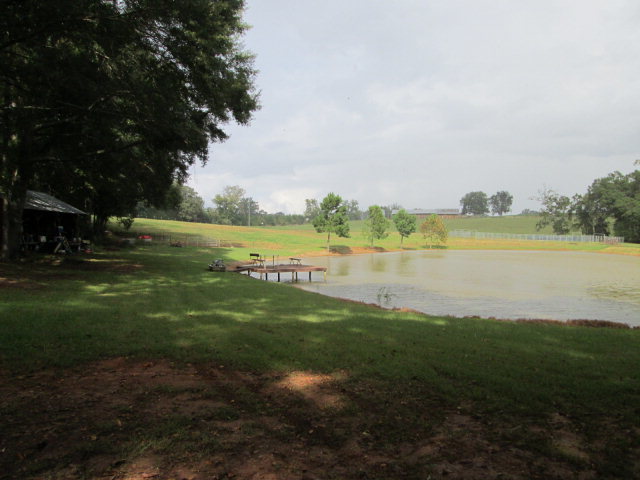 201 Dye Road Gray, GA 31032 - Photo 8 of 20 a view of a lake with houses in the back