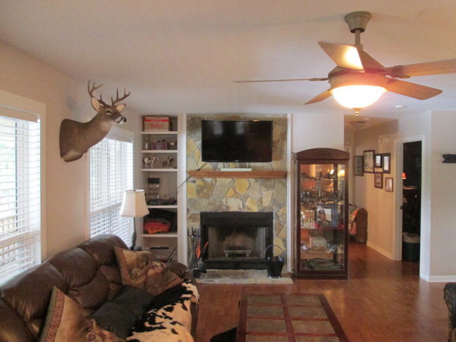 201 Dye Road Gray, GA 31032 - Photo 10 of 20 a living room with furniture a flat screen tv and a fireplace