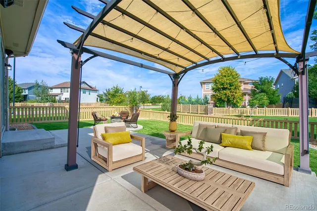 a balcony with furniture and a garden