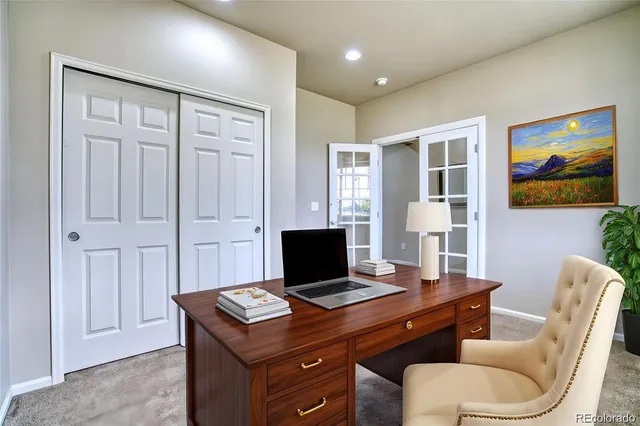 a view of a workspace with furniture