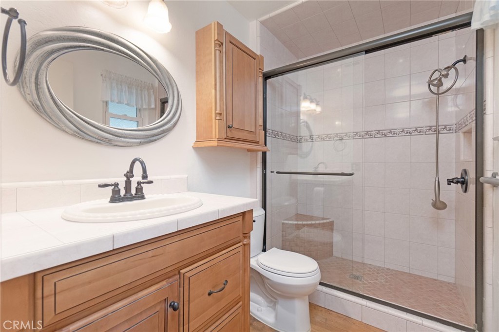 7210 Mesada Street Rancho Cucamonga, CA 91701 - Photo 18 of 32 a bathroom with a sink a toilet and a shower
