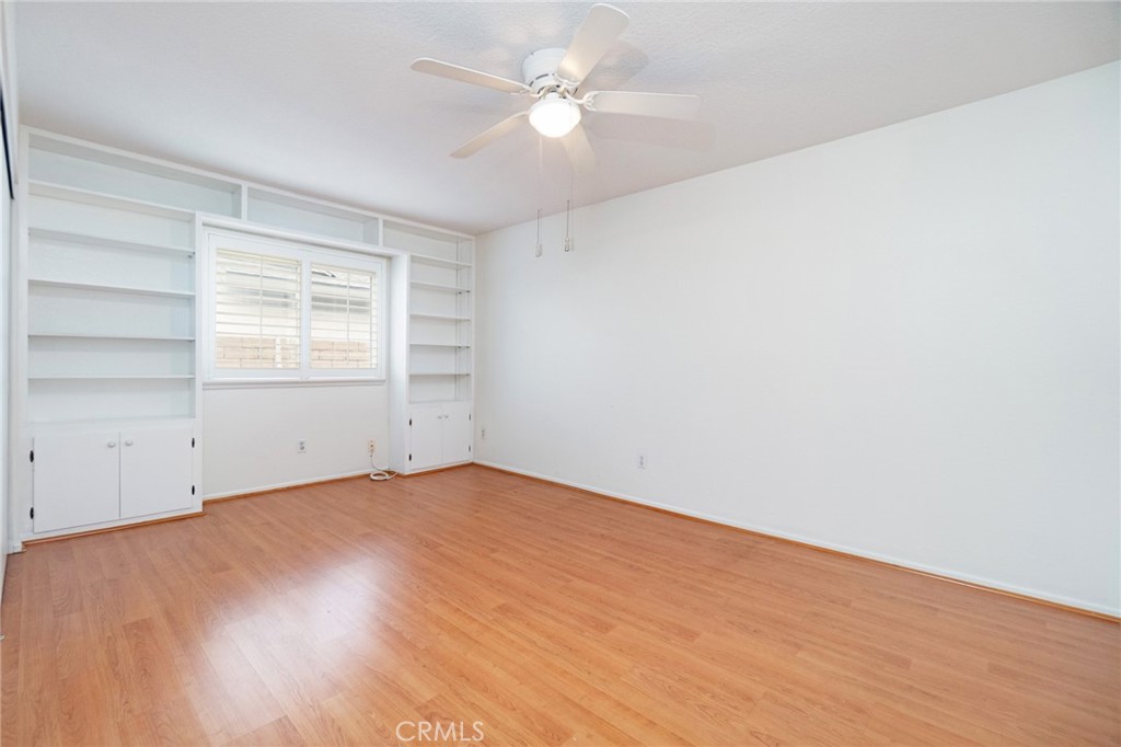 7210 Mesada Street Rancho Cucamonga, CA 91701 - Photo 20 of 32 an empty room with a window and a ceiling fan