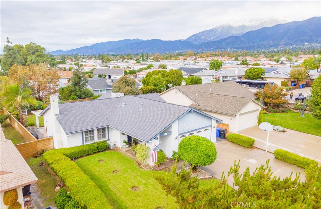 7210 Mesada Street Rancho Cucamonga, CA 91701 - Photo 2 of 32 an aerial view of residential houses and outdoor space