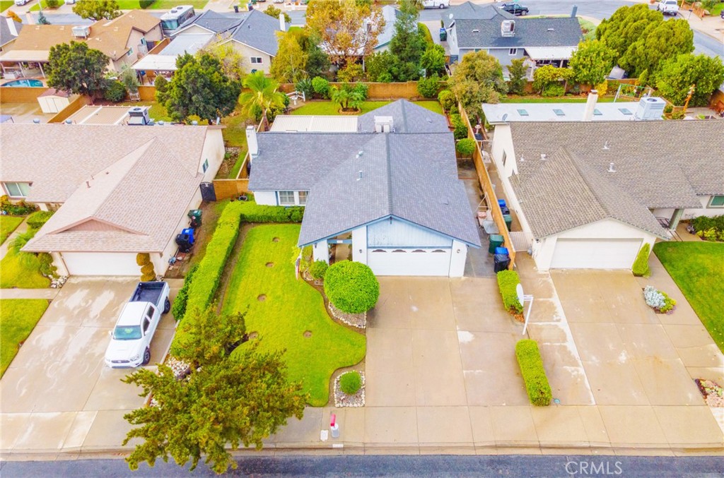 7210 Mesada Street Rancho Cucamonga, CA 91701 - Photo 24 of 32 an aerial view of a swimming pool with a yard