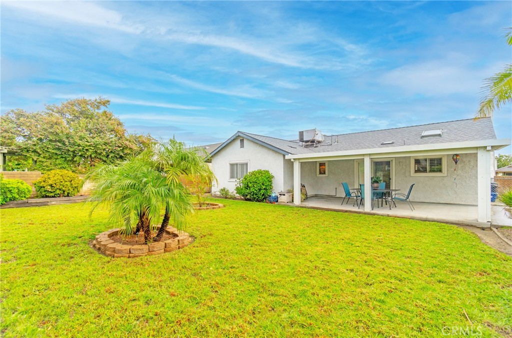 7210 Mesada Street Rancho Cucamonga, CA 91701 - Photo 26 of 32 a view of a house with swimming pool and a yard