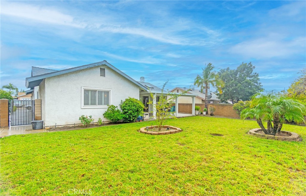 7210 Mesada Street Rancho Cucamonga, CA 91701 - Photo 27 of 32 a view of a house with a yard