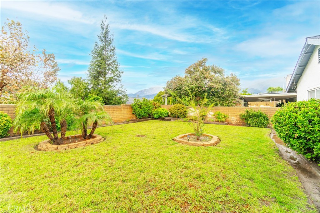 7210 Mesada Street Rancho Cucamonga, CA 91701 - Photo 31 of 32 a swimming pool with trees in front of it