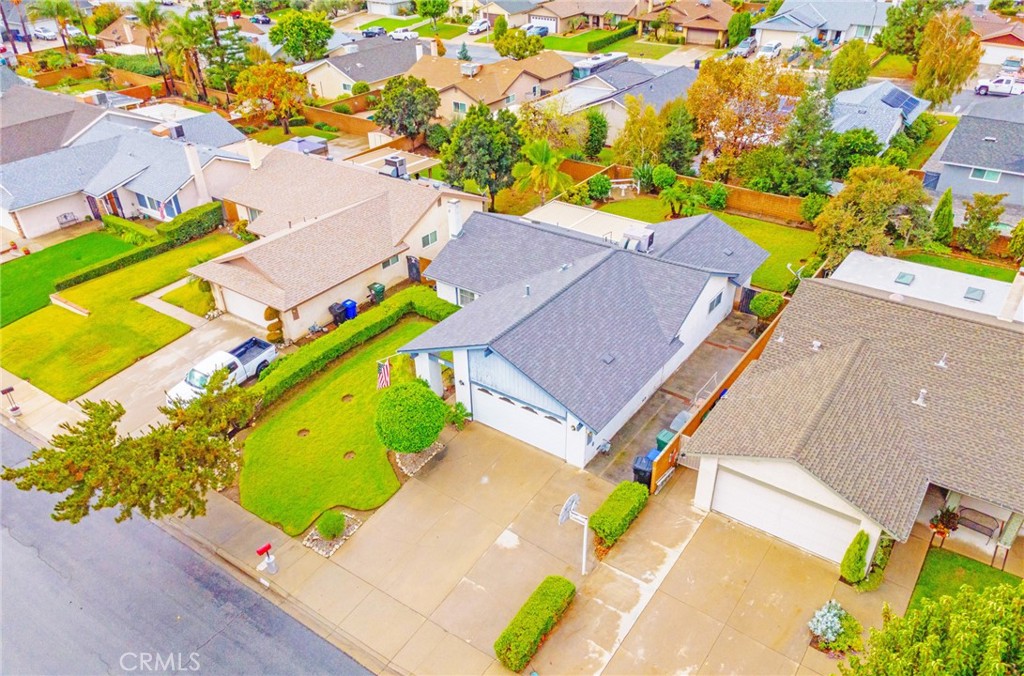 7210 Mesada Street Rancho Cucamonga, CA 91701 - Photo 4 of 32 an aerial view of a house with a garden and swimming pool