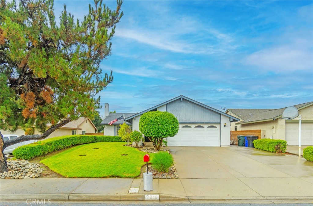 7210 Mesada Street Rancho Cucamonga, CA 91701 - Photo 5 of 32 a view of a house with a yard and potted plants