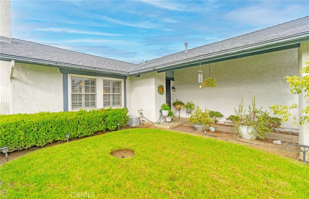 7210 Mesada Street Rancho Cucamonga, CA 91701 - Photo 9 of 32 a front view of a house with a yard