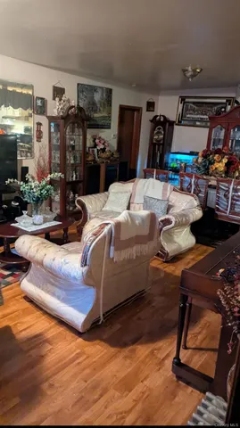 a view of living room filled with furniture and a table