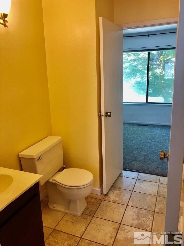 1298 Conway Lane Reno, NV 89503 - Photo 12 of 27 a bathroom with a toilet and a shower