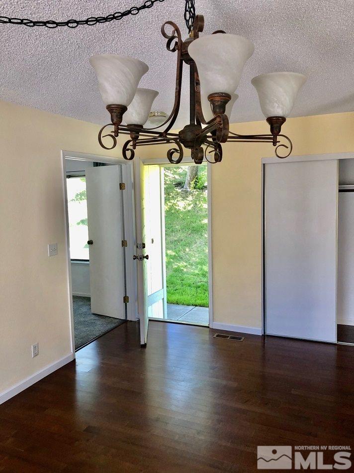 1298 Conway Lane Reno, NV 89503 - Photo 14 of 27 a view of an entryway with wooden floor