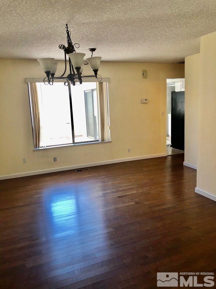 1298 Conway Lane Reno, NV 89503 - Photo 16 of 27 a view of room with window and wooden floor