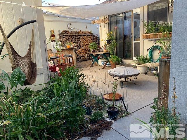 1298 Conway Lane Reno, NV 89503 - Photo 2 of 27 an outdoor space with patio furniture and potted plants