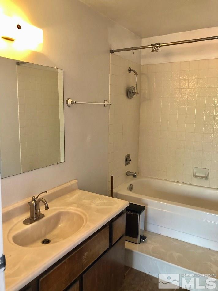 1298 Conway Lane Reno, NV 89503 - Photo 9 of 27 a bathroom with a sink and a bathtub