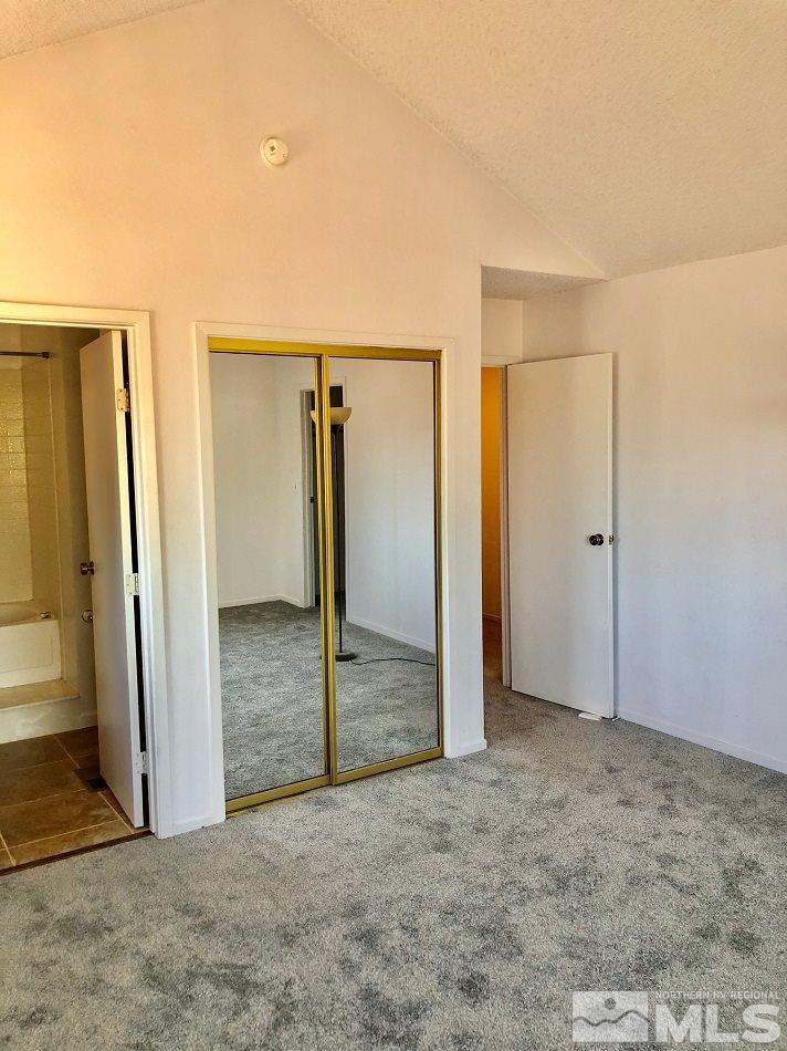 1298 Conway Lane Reno, NV 89503 - Photo 10 of 27 an empty room with closet and wooden door