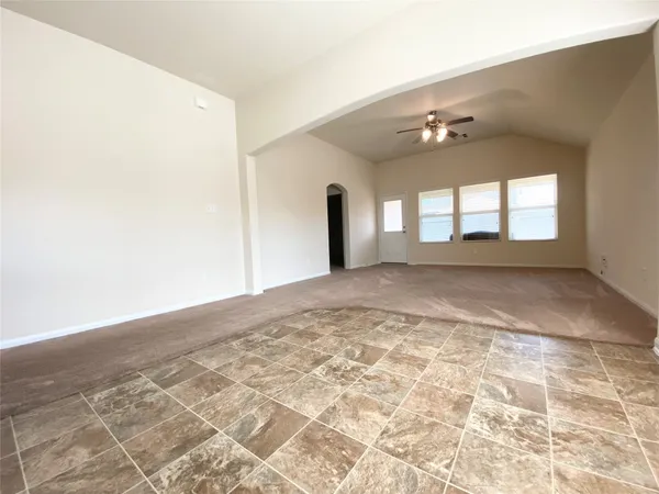 a view of empty room with a fireplace