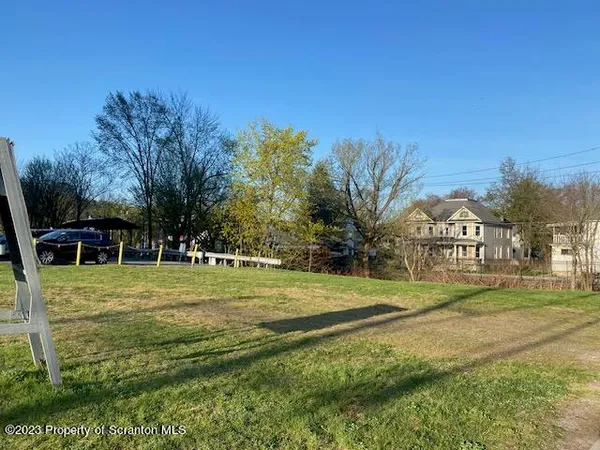 a view of a house with a big yard
